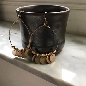 Gold tone dancing earrings